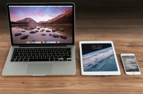 macbook pro beside white ipad